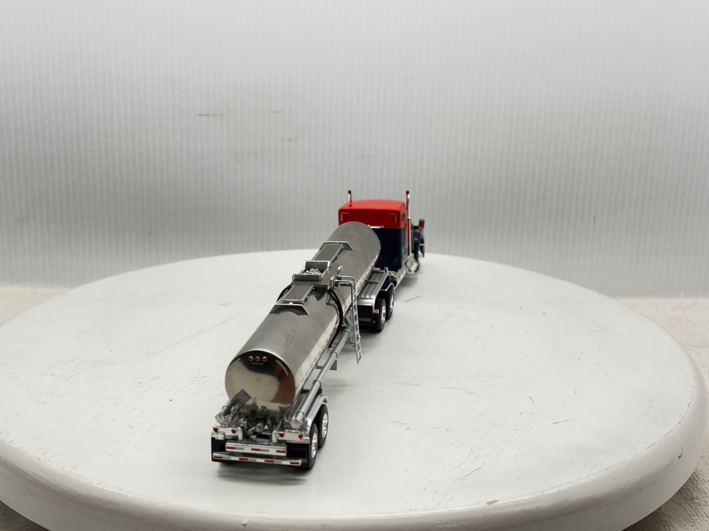 1/64 Kenworth W990 76'' Midroof (Orange-Blue)