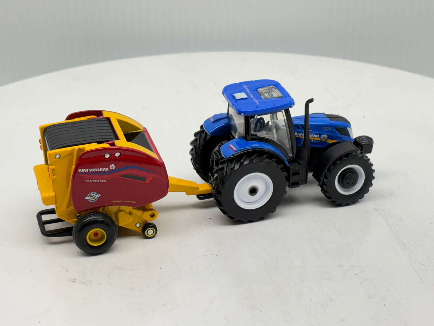 1/64 New Holland T6.180 - Roll-Belt 560