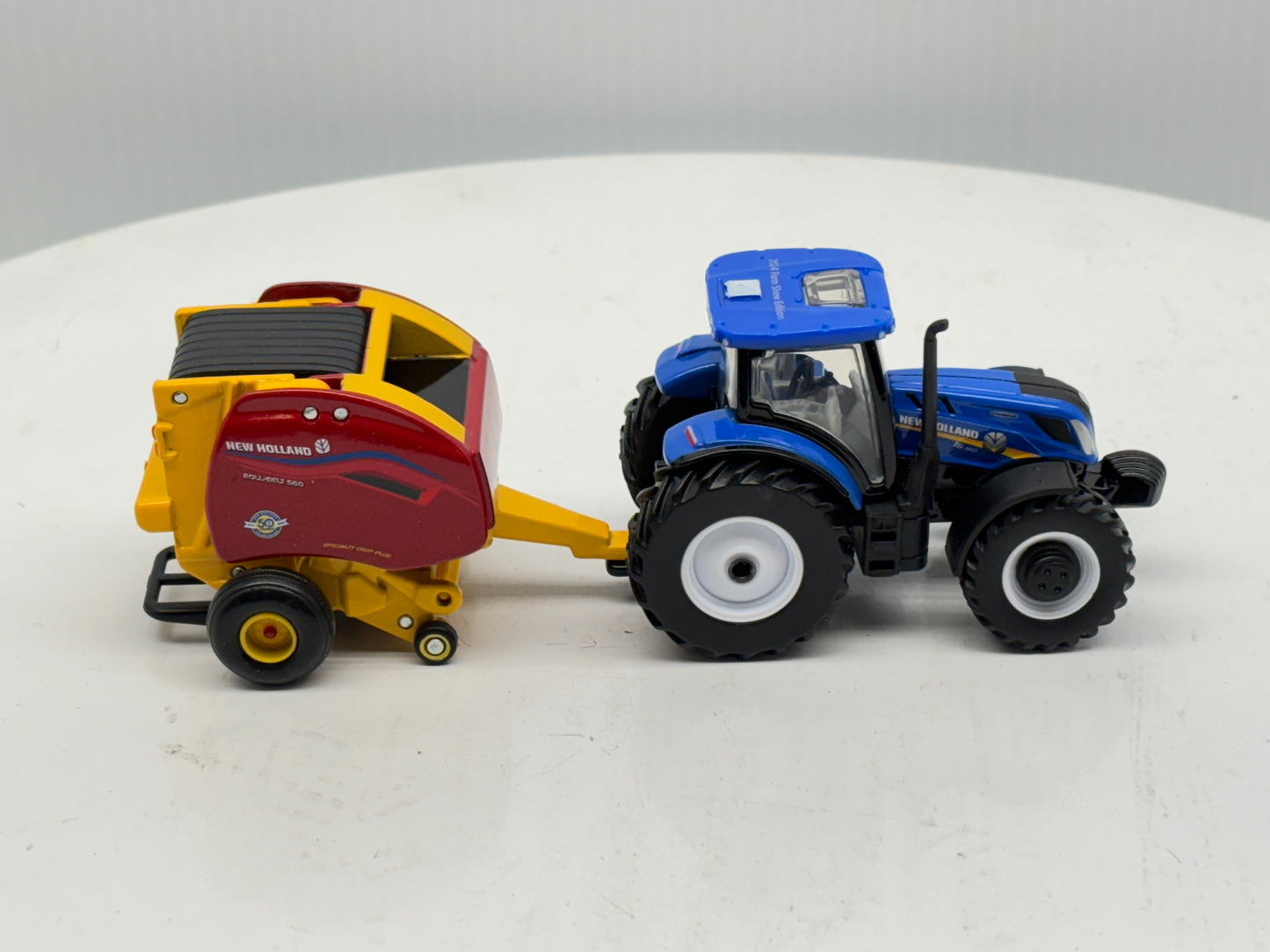 1/64 New Holland T6.180 - Roll-Belt 560