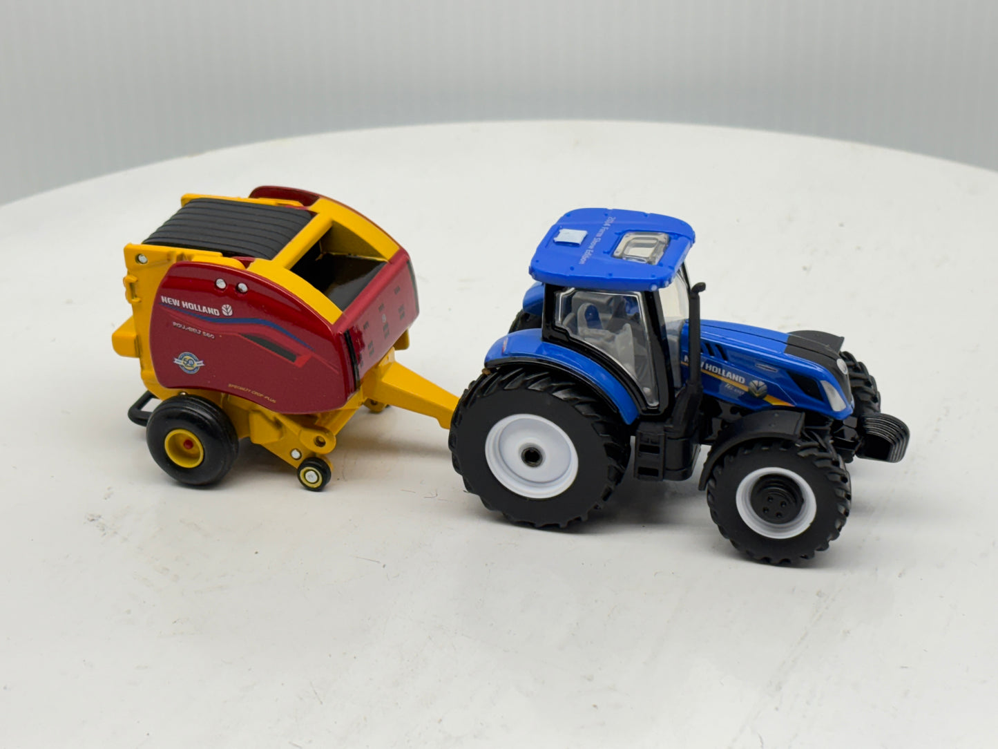 1/64 New Holland T6.180 - Roll-Belt 560