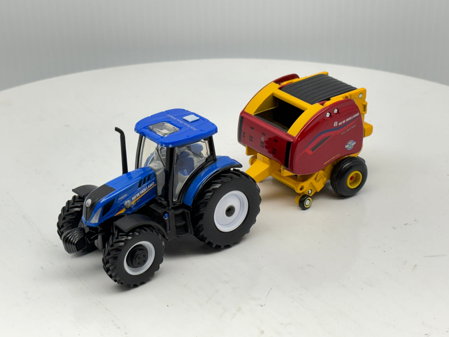 1/64 New Holland T6.180 - Roll-Belt 560