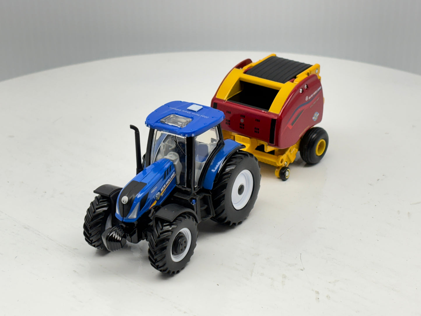 1/64 New Holland T6.180 - Roll-Belt 560