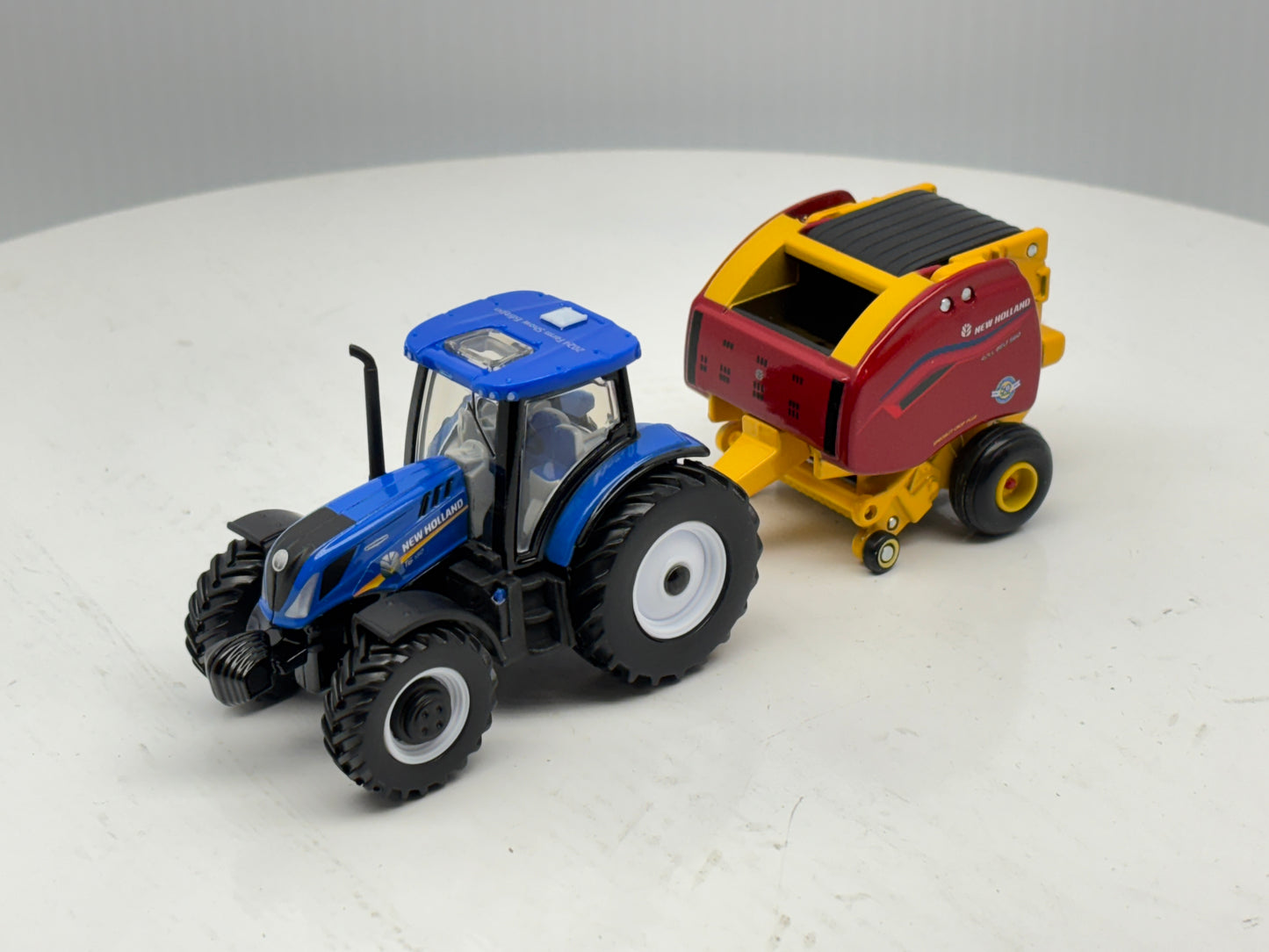 1/64 New Holland T6.180 - Roll-Belt 560