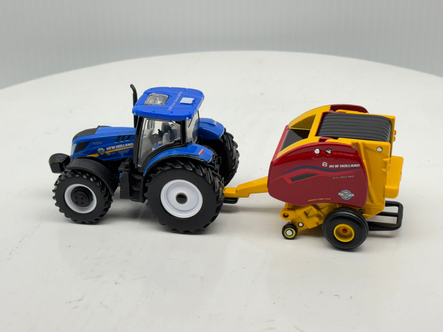 1/64 New Holland T6.180 - Roll-Belt 560