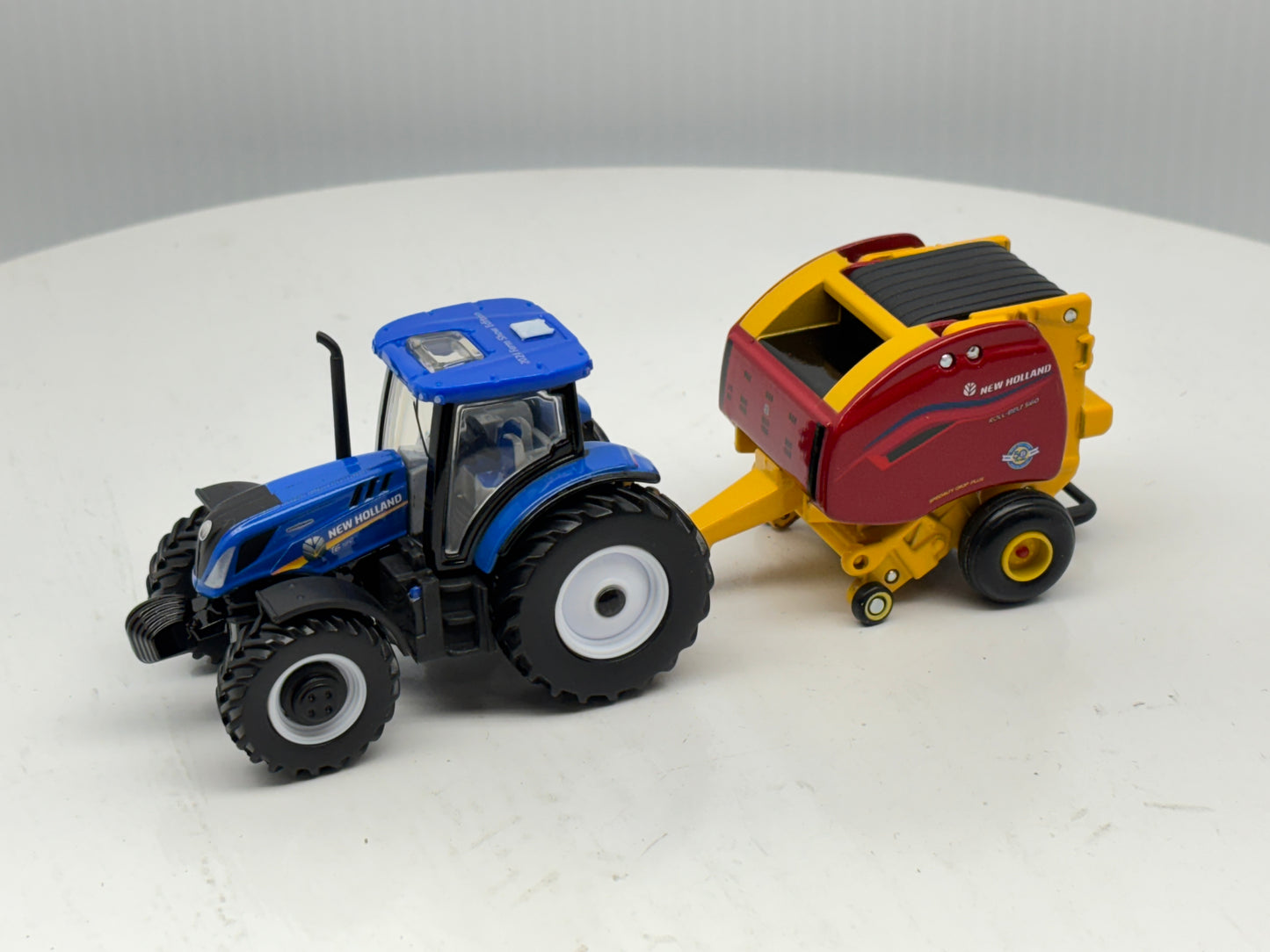 1/64 New Holland T6.180 - Roll-Belt 560