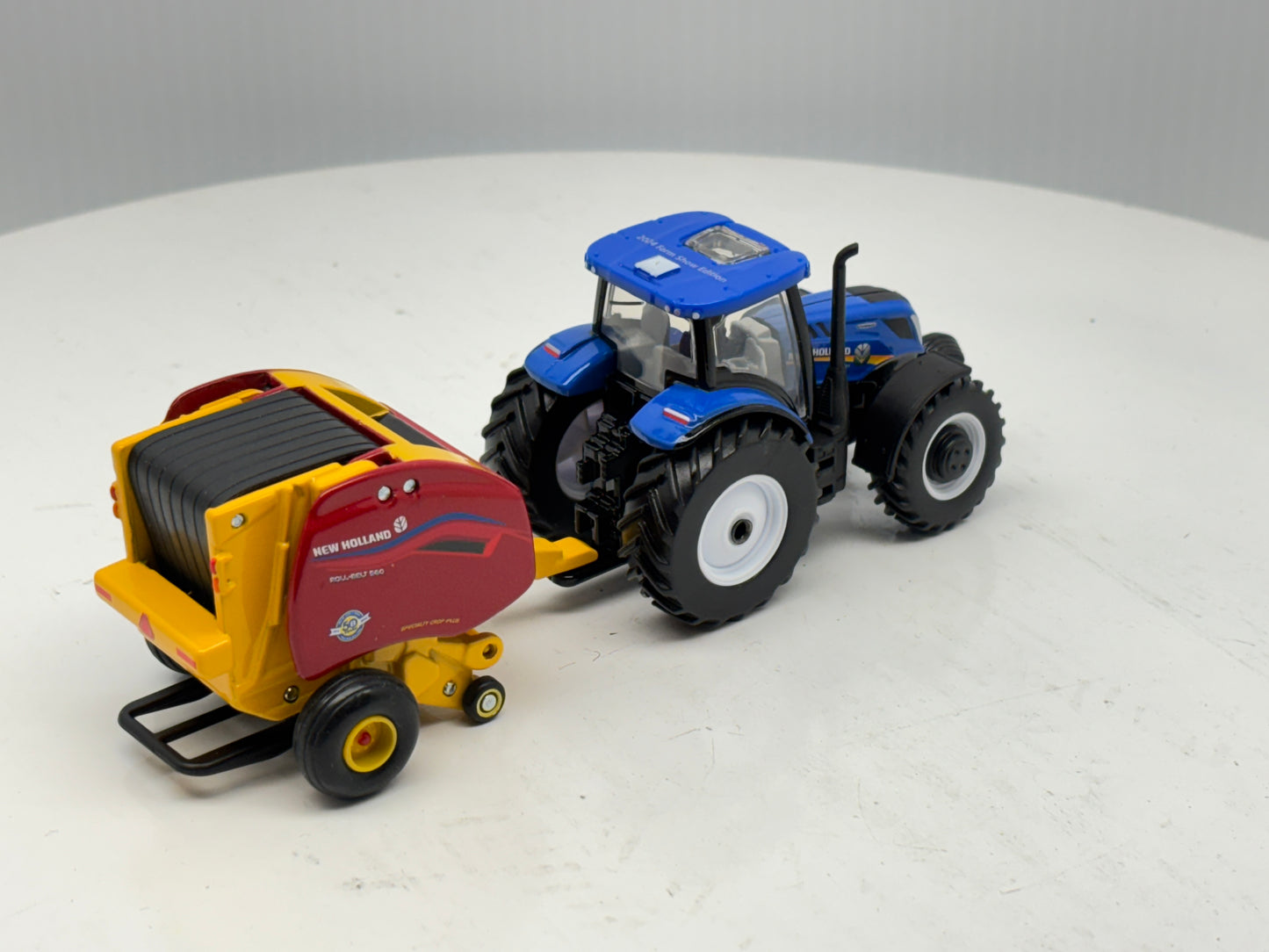 1/64 New Holland T6.180 - Roll-Belt 560
