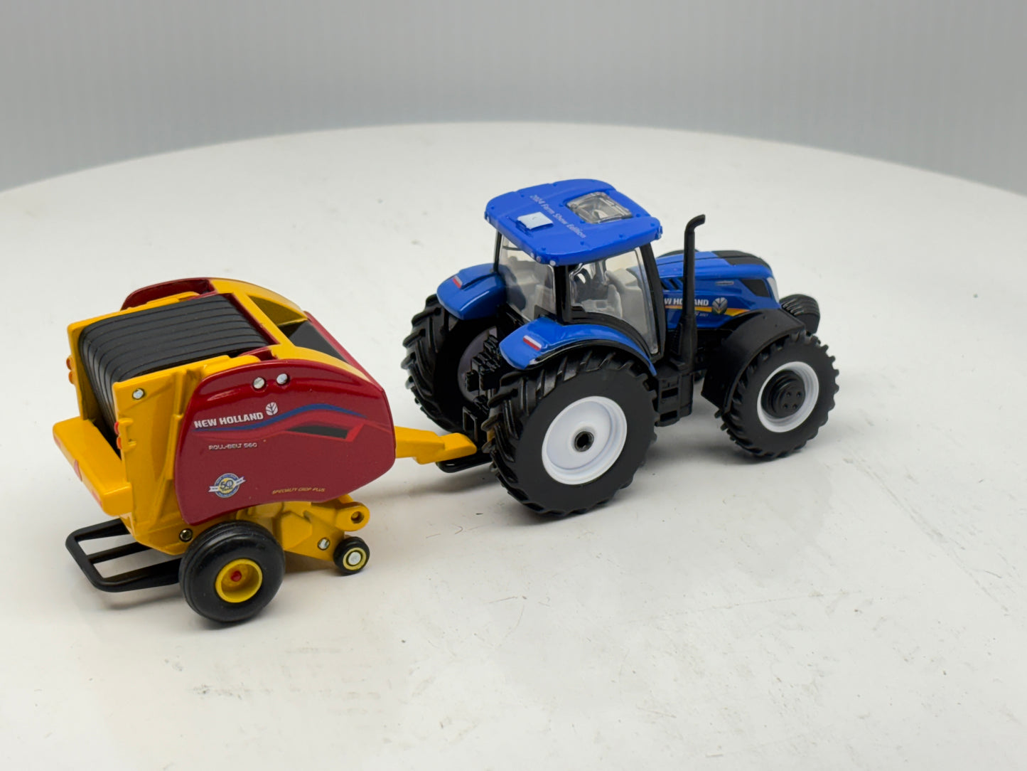 1/64 New Holland T6.180 - Roll-Belt 560
