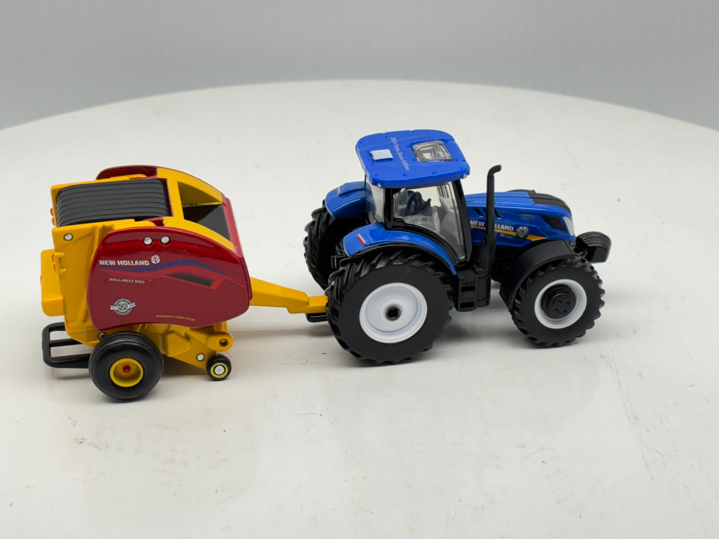 1/64 New Holland T6.180 - Roll-Belt 560