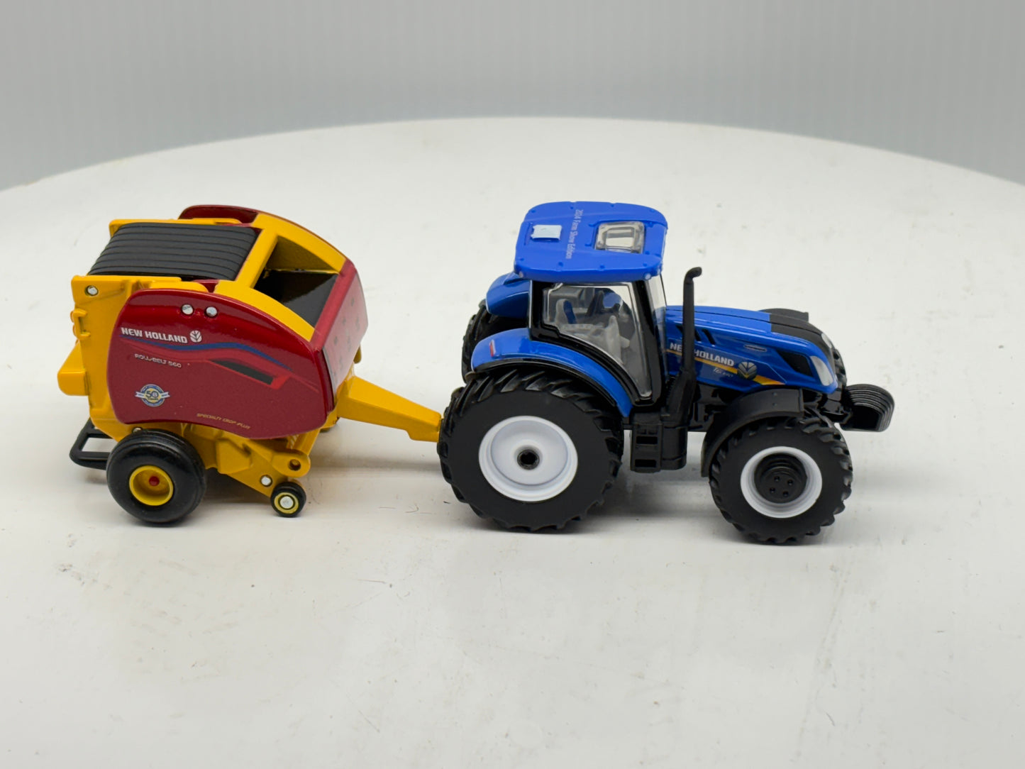 1/64 New Holland T6.180 - Roll-Belt 560