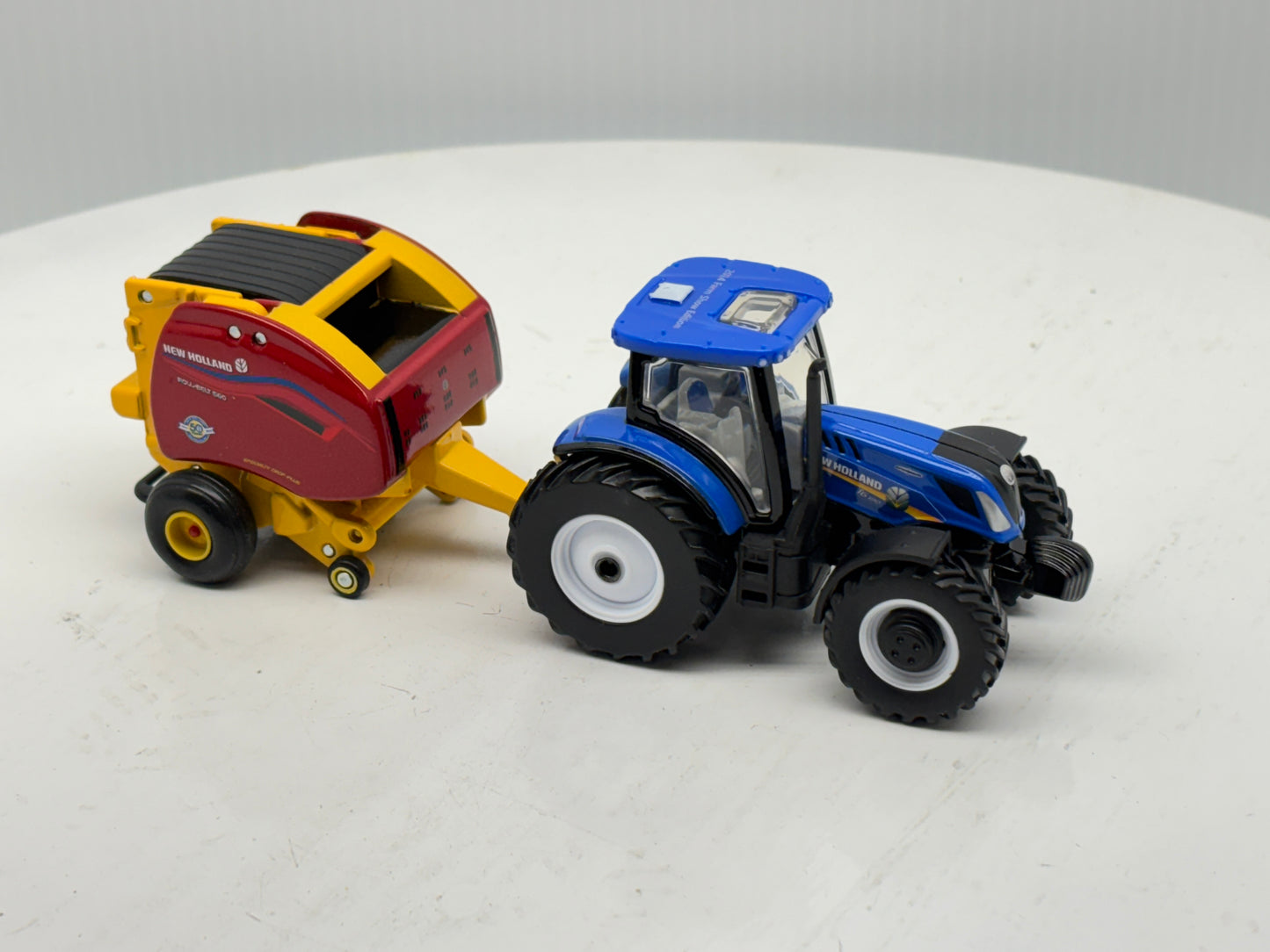 1/64 New Holland T6.180 - Roll-Belt 560