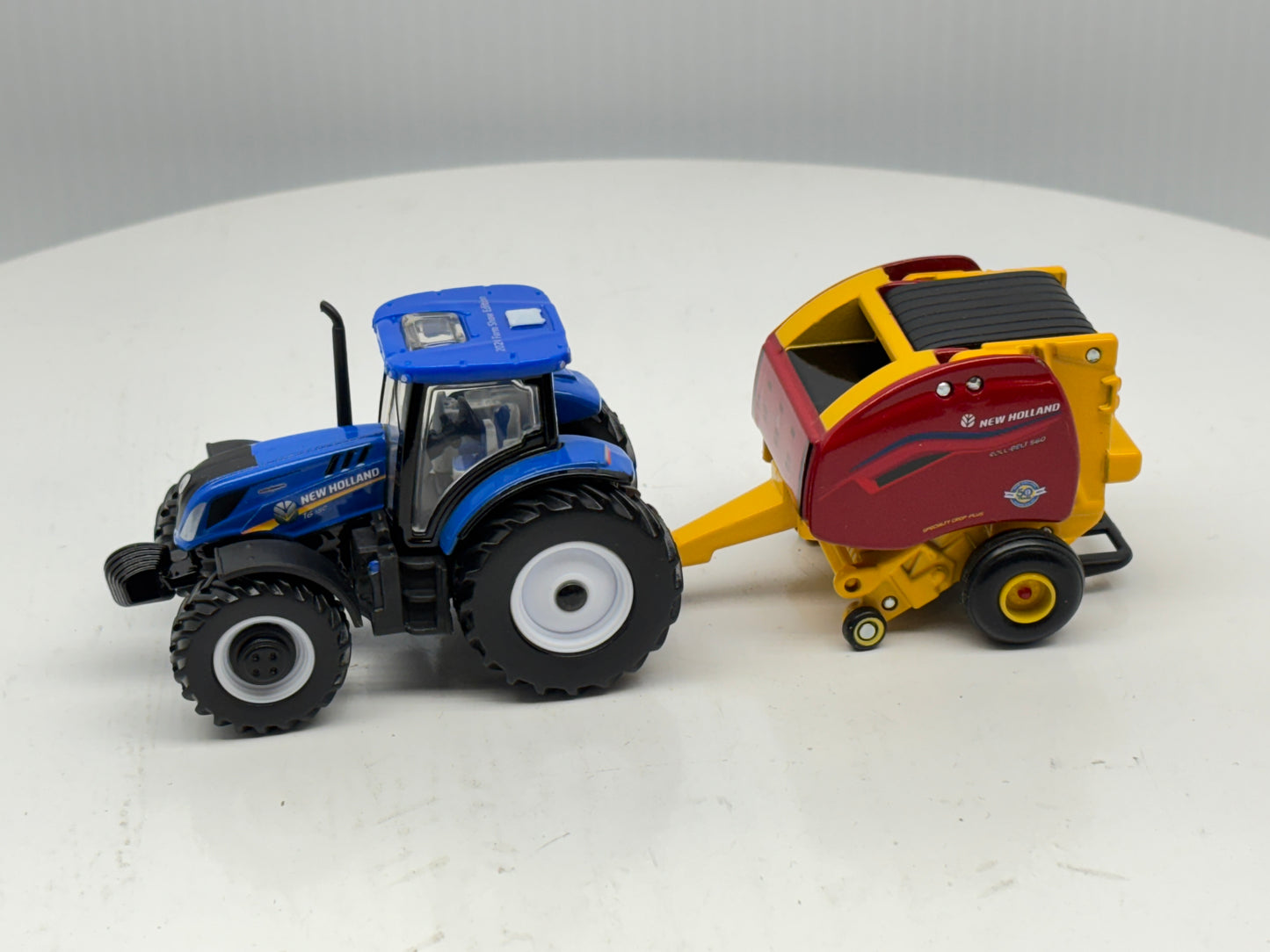 1/64 New Holland T6.180 - Roll-Belt 560
