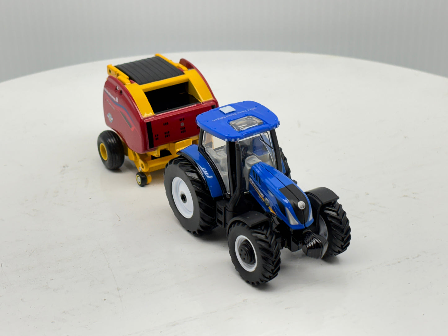 1/64 New Holland T6.180 - Roll-Belt 560