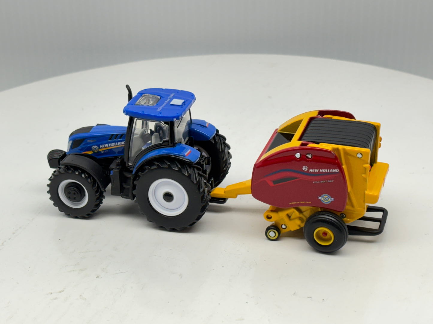 1/64 New Holland T6.180 - Roll-Belt 560