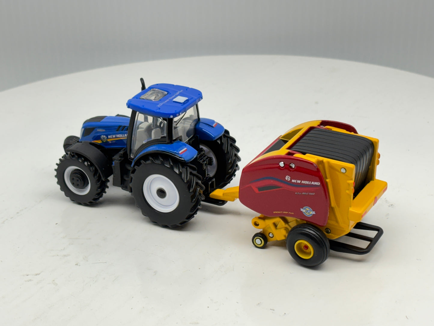 1/64 New Holland T6.180 - Roll-Belt 560