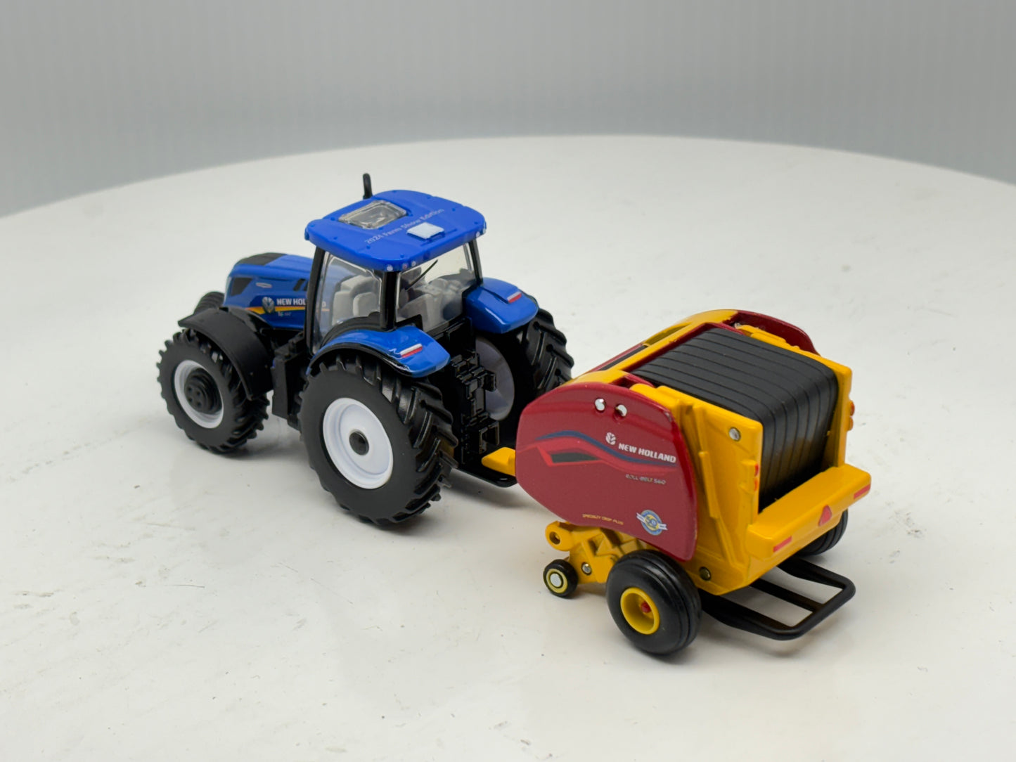 1/64 New Holland T6.180 - Roll-Belt 560