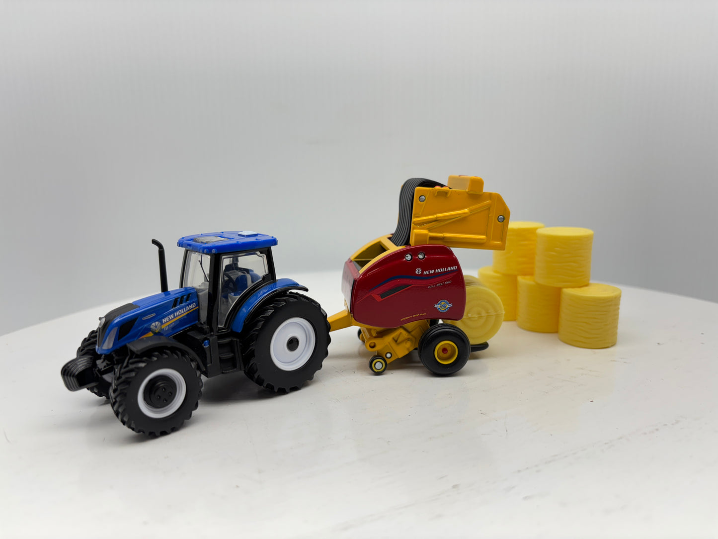 1/64 New Holland T6.180 - Roll-Belt 560