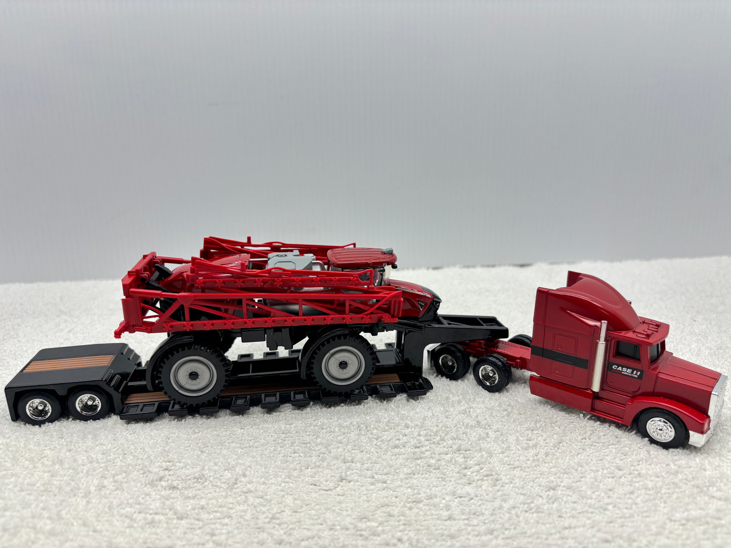 1/64 Case IH 4350 with Trucks and lowboy trailer