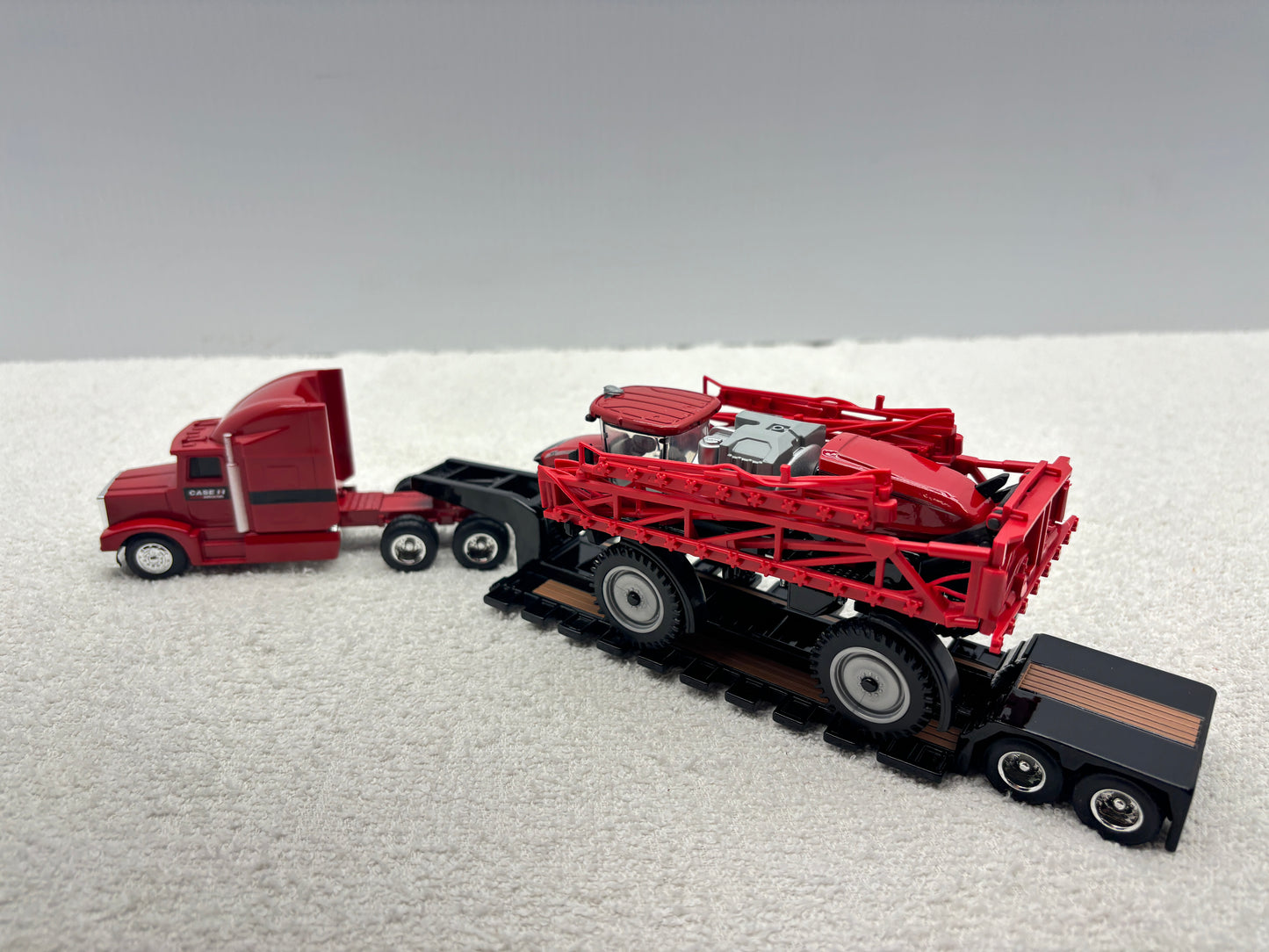 1/64 Case IH 4350 with Trucks and lowboy trailer