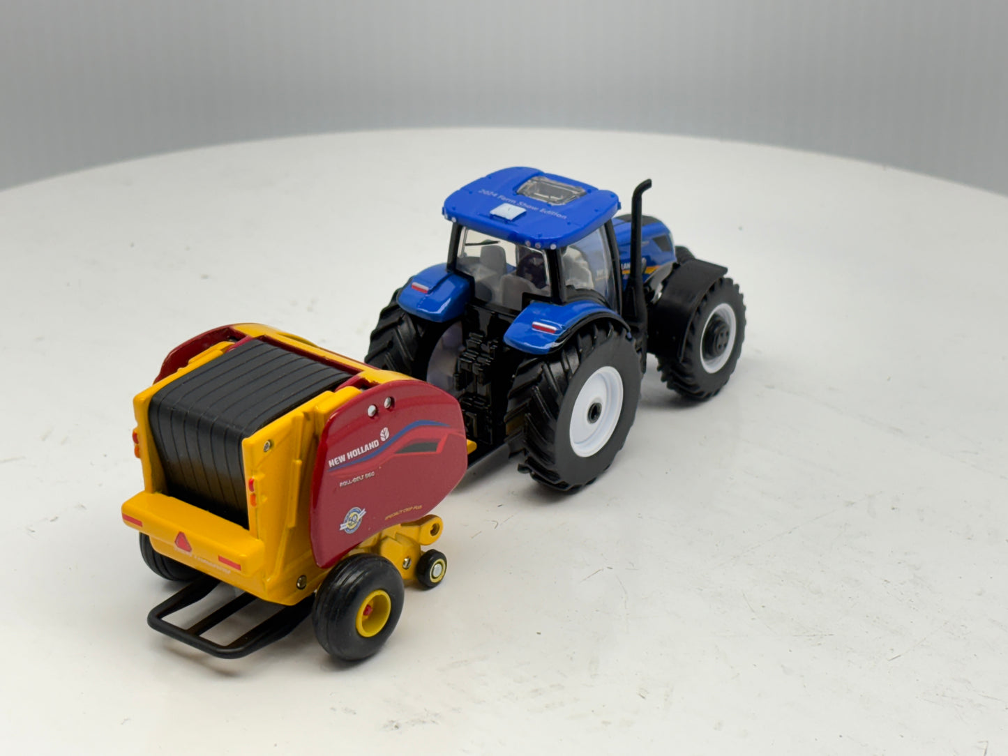 1/64 New Holland T6.180 - Roll-Belt 560